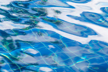 Fototapeta na wymiar Waving blue water surface. blue clear fresh Water in jacuzzi.