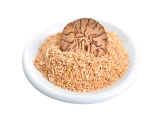 Nutmeg, fragrant nutmeg or true nutmeg. Half nut and powder. Isolated on white background