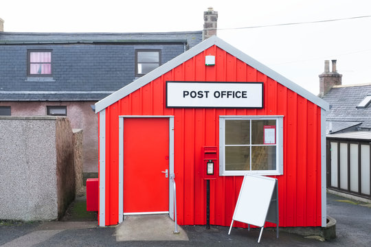 Red post office in rural isolated countryside island Scotland UK