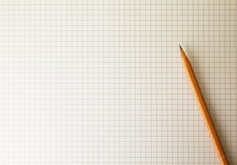 Drafting paper or graph paper with pencil under warm incandescent light