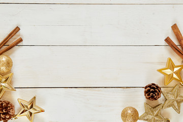 Christmas decoration. wooden background with copy space. Golden balls, stars and brownish aesthetics © alfa27