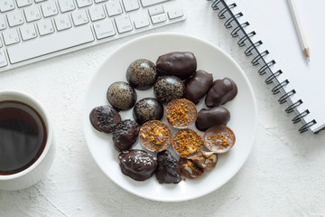 Chocolate candies handmade on the desktop. Sweets cooked at home. 