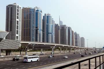 Fototapeta na wymiar Dubai downtown skyscrapers, highway and metro.