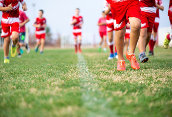 Obraz premium Young soccer players running