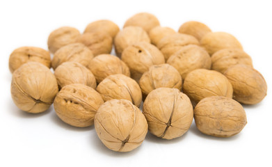 Useful walnuts, close-up, isolated on white background.