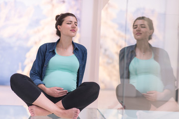 pregnant women sitting on the floor