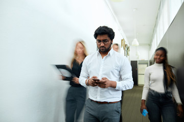 Fototapeta premium Indian guy leaves in the unreal world. bad habit. blurred photo