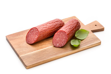 Salami smoked sausage, basil leaves on white background cutout.