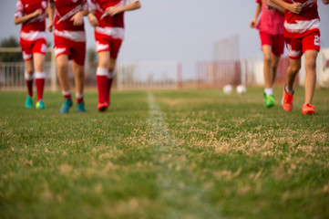 Young soccer players running