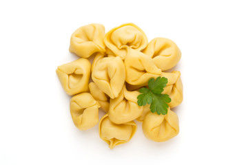 Raw homemade pasta,tortellini with herbs.