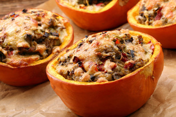 Stuffed autumn pumpkin with rice and mushrooms, seasonal dinner