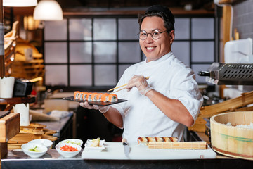 happy chef taking part on TV show. close up photo. man leads cooking TV program