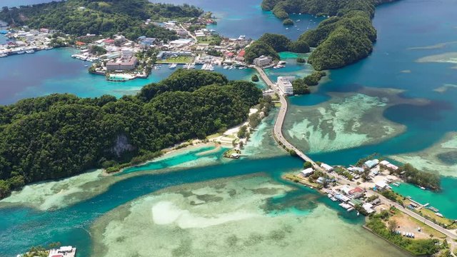 Aerial panoramic view of city of Koror, azure crystal clear water of western Pacific Ocean - landscape panorama of Micronesia from above, Koror Island, Palau