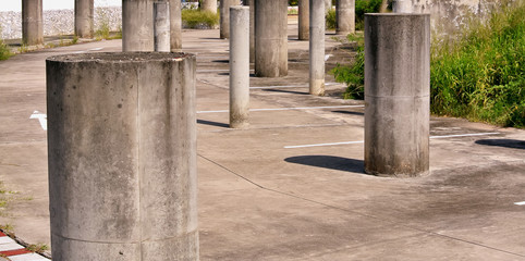 Group of Concrete Pillars at Abandoned Parking Lot