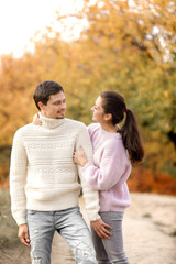 Fototapeta premium Couple in love in the autumn leaves