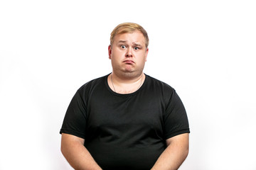 Offended fat stout blonde man with duck lips, looking at camera with upset, disappointed...