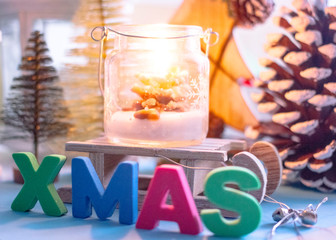 Christmas background - wooden sleds on which large colored letters with the letter 