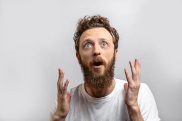 Handsome astonished male, good soul, looking with great surprisment and gratitude as if he has got...