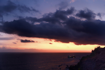 Beautiful cloudy sky over sea at sunset