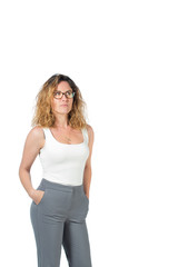 Fototapeta premium business woman in white shirt and gray pants on a white background. beautiful girl in glasses holds hands in pants, looking at camera . isolated on background, copy space.