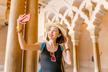 Woman traveler at the Aljaferia, one of the most famous places in Zaragoza. Moorish Islamic palace...