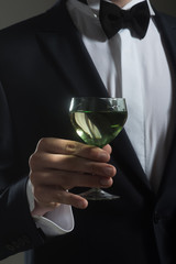 man drink wine. wedding. Bride groom on husband with glass. successful business meeting. Deal. formal male fashion. chears. To us. birthday party toast. businessman
