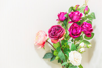 rose flower plastic on white wallpaper background