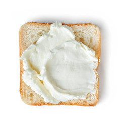 Fresh cream cheese on bread isolated on white background