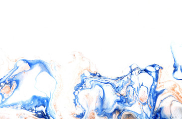 Very beautiful textural background. Blue paint flows in a yellow-gold color on a yellow background. The style includes curls of marble or pulsations of agate with bubbles and cells.