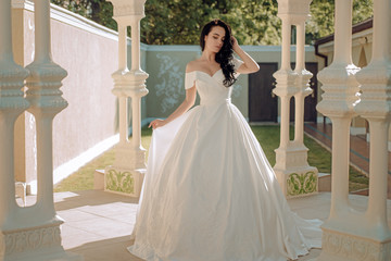 Obraz premium Elegant wedding salon is waiting for bride. Happy bride before wedding. Wonderful bridal gown. Beautiful wedding dresses in boutique. woman is preparing for wedding. Dreams come true. Happy moment