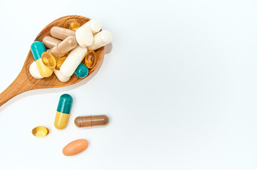 Piils background. Tablets. Medical background with pills and vitamins. spoon with vitamins, pills