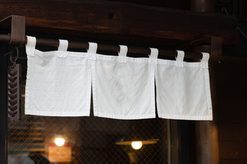 The curtain-like fabric that hangs in front of traditional Japanese restaurants and shops not only serves as a signboard, but holds a larger meaning,