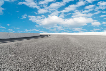 Empty asphalt road and natural landscape under the blue sky