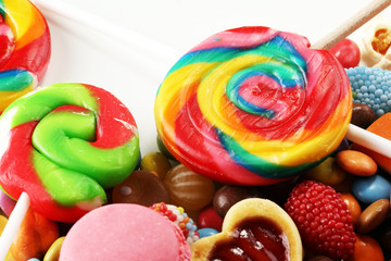 candies with jelly and sugar. colorful array of different childs sweets and treats.