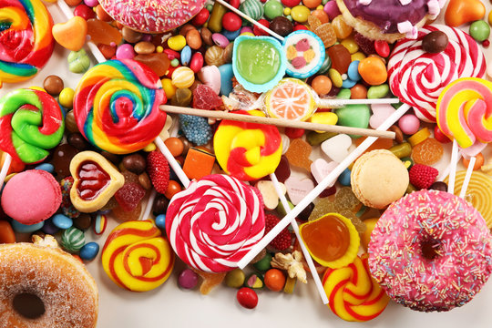 candies with jelly and sugar. colorful array of different childs sweets and treats.