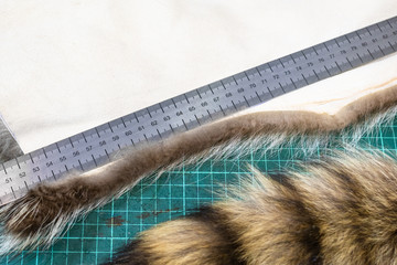 ruler on a fur pelt on cutting mat