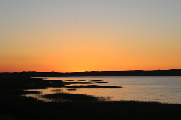 Summer golden sunrise on the lake