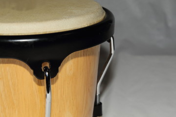 Single bongo up close along the left side with a white backdrop