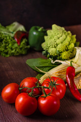 Fresh organic vegetables on wooden background