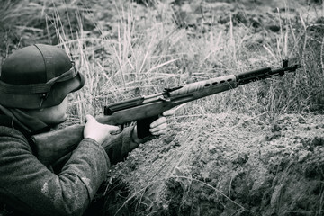 German soldier World War II in a trench with a rifle