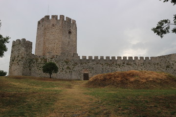 Fototapeta na wymiar Wall and main tower of the medieval Platamonas castle, Greece