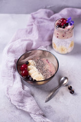Healthy smoothy and pudding chia boul for breakfast with banana, cherry, and black currant
