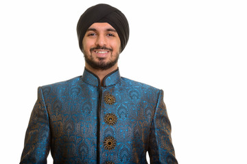 Young happy Indian Sikh smiling wearing traditional clothes