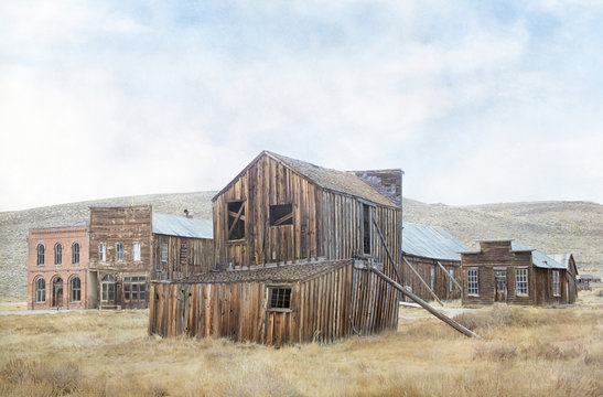 Original textured photograph of a gold mining ghost town with dilapidated buildings