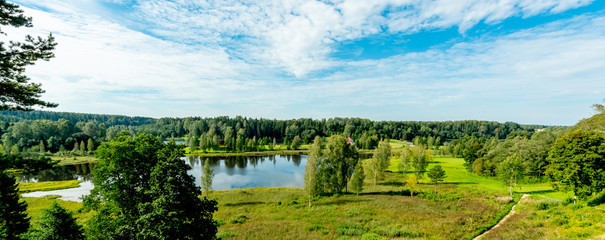 estonian landscape with river and blue sky