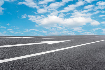 Empty highway asphalt pavement and sky cloud landscape..
