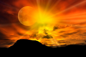 Fototapeta premium Sunset in an eclipse of sun in the mountains