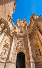 Fototapeta na wymiar Facade and gate of the Basilica of the Assumption of Our Lady of Valencia, Spain (Saint Mary's Cathedral or Valencia Cathedral).Known as 