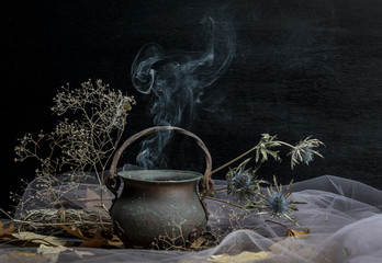 Magic pot of herbs and witchcraft