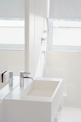Bathroom interior sink with modern design. Interior of bathroom with washbasin and faucet